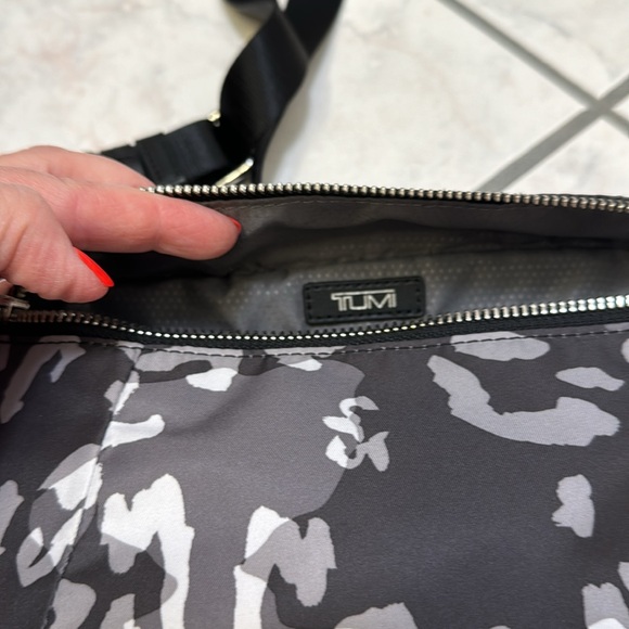 Tumi. New without tags. Endless pockets. - Picture 3 of 10